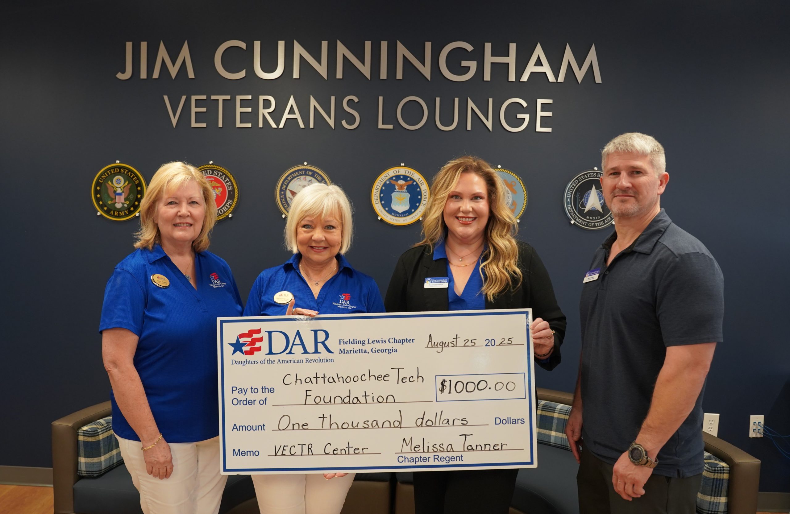 Shown here, l-r, are Karen Kivette, Past Chapter Regent; Melissa Tanner, Chapter Regent; Amanda Henderson, Director of Advancement; and Michael Payne, Director of Veteran Services.